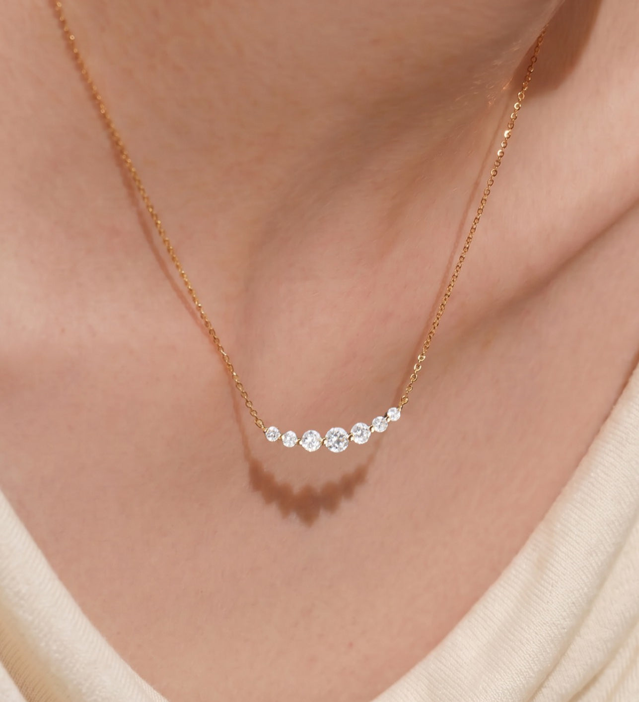 3-Serena-orlueur-curved-bar-diamond-necklace-on-model-neck
