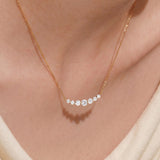 3-Serena-orlueur-curved-bar-diamond-necklace-on-model-neck