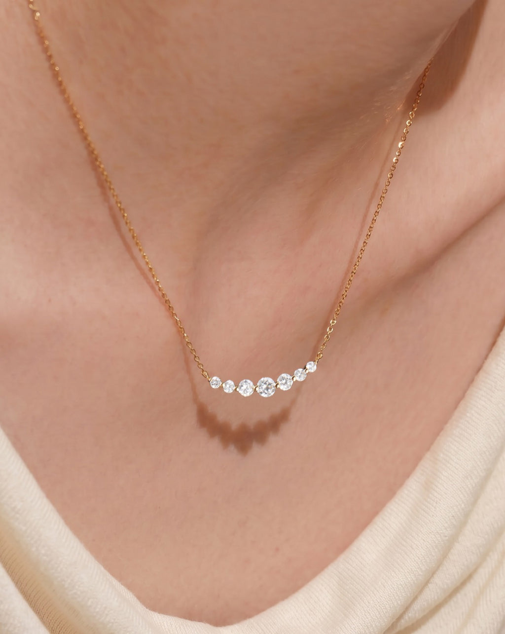 3-Serena-orlueur-curved-bar-diamond-necklace-on-model-neck