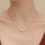 orlueur-Serena-curved-bar-diamond-necklace-on-model-neck